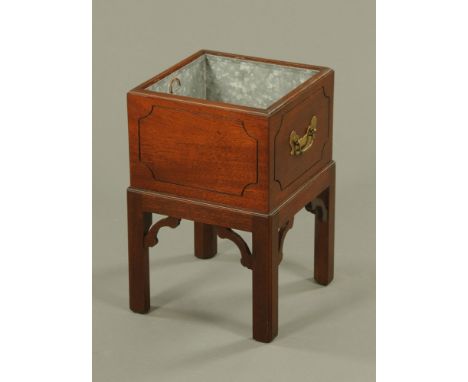A Chippendale style mahogany planter, with panelled sides and raised on legs of square section with fretwork spandrels.  Heig