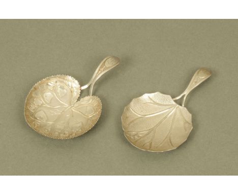 Two George III silver leaf form caddy spoons by Matthew Linwood, Birmingham 1807 and 1808. CONDITION REPORT: The two spoons i
