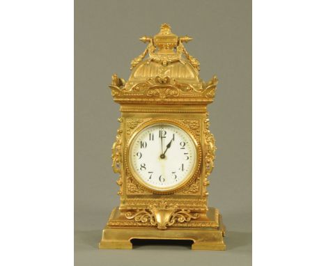 A brass cased French mantle clock, with single train spring driven movement.  Height 29 cm, width 16 cm, depth 15 cm.