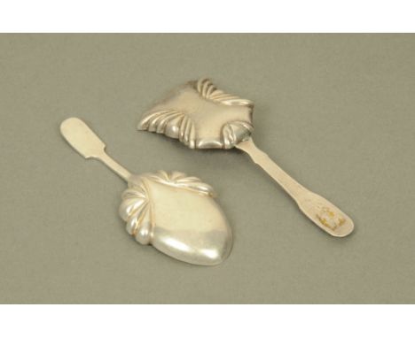 Two George IV silver caddy spoons by Thomas Millington, with shaped and panelled bowls, Birmingham 1826 and 1827. CONDITION R