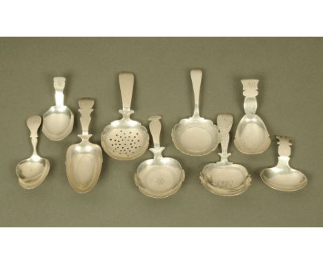 Nine George III silver caddy spoons by Thomas James, displaying various shapes and styles and including a spoon with pierced 