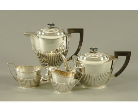 A four piece silver tea service Birmingham 1975, maker Barker Ellis Silver Company, 1662 grams  (see illustration).