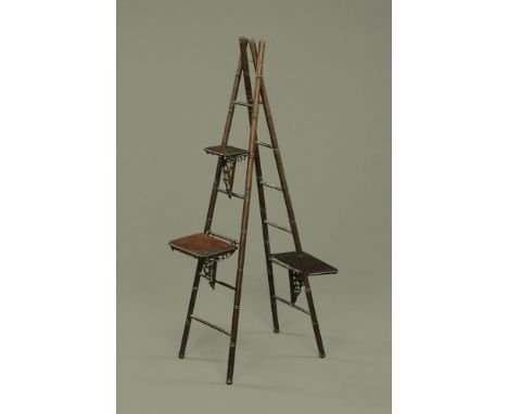 A 19th century Chinese hardwood ladder form stand with three shelves.  Height 119 cm. CONDITION REPORT: The two sides of the 