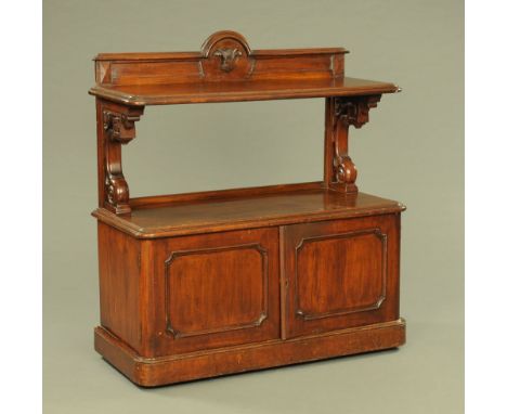 A Victorian oak dumbwaiter, with rear upstand and open shelf with pair of panelled cupboard doors beneath and raised on a pli