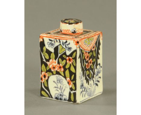 A late 18th/early 19th century Dutch polychrome Delft pottery square section tea caddy, decorated with flowers and leaves on 