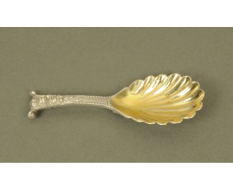 An early Victorian silver caddy spoon by Chawner & Co, with leaf cast scrolled terminal and silver gilt scallop bowl, London 