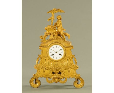 A 19th century French mantle clock, with male figure seated beneath a tree above the dial and two train movement striking on 