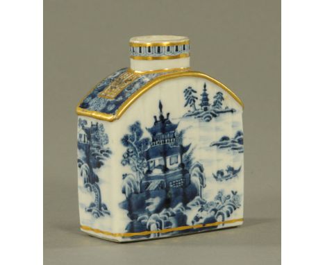 An 18th century Chinese blue and white porcelain tea caddy, with gilded rims and arched top, decorated with pagodas and with 