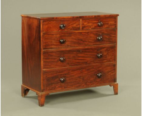 A 19th century mahogany chest of two short and three long graduated drawers with wooden knob handles and cockbeading to each 