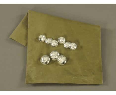 Four modern white metal SAS buttons by Gaunt, six smaller buttons by FSE, in green canvas bag and a quantity of military badg