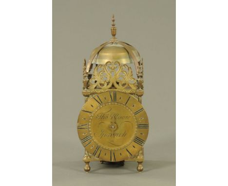 A reproduction brass lantern clock by Thomas Moore Ipswich.  Height 38 cm, dial diameter 17 cm.