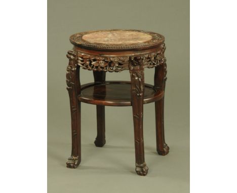 A 19th century Chinese hardwood rouge marble topped jardiniere stand, with shelf and raised on shaped legs.  Height 65 cm, di
