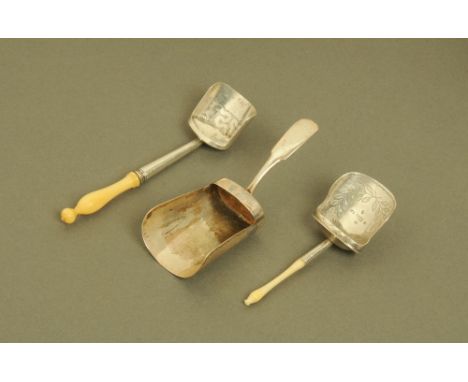 A George III silver shovel form caddy spoon by Wardell & Kempson, with seaweed engraved bowl and turned ivory terminal, Birmi