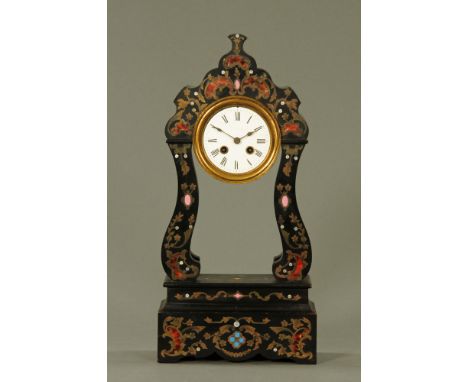 A late 19th century French ebonised and Boulle work mantle clock of rococo design, with enamelled dial to two train movement 