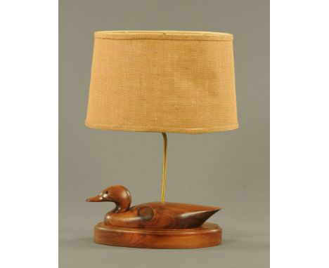 A carved and stained pine decoy duck pattern electric lamp, with hessian shade, 55 cm high.  CONDITION REPORT: This lamp is s