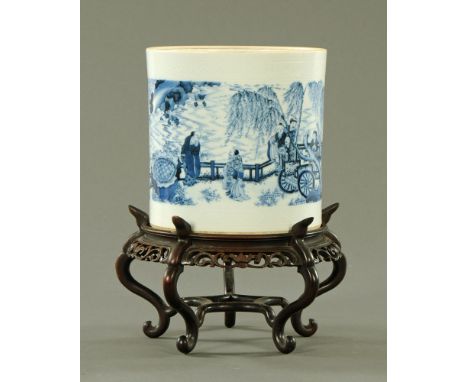 A Chinese blue and white porcelain brush pot, decorated with a continuous scene of figures in a landscape with an elder fishi