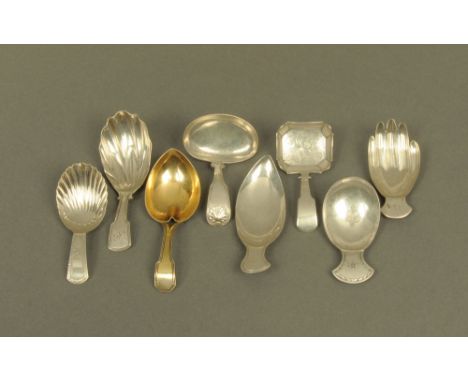 Eight George III silver caddy spoons by Josiah Snatt, displaying different patterns and styles, including hand form spoon and