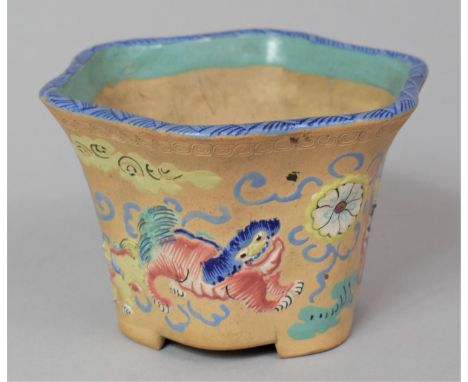 A Small Chinese Earthenware Hexagonal Planter with Applied Enamels Depicting Temple Lions in the Famille Rose Pallette, 9.5cm