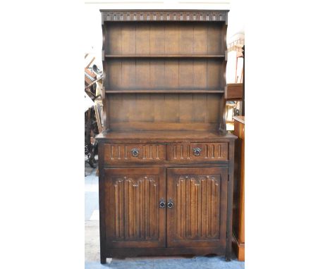 A Mid 20th Century Oak Linenfold Dresser with Two Centre Drawers Over Cupboard Base and Two Shelf Plate Rack, 96cm wide 