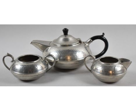 A Hand Beaten Pewter Three Piece Tea Service by Hall Brothers, Sheffield 