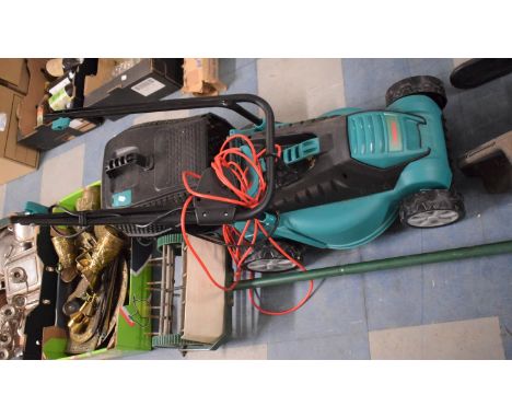An Electric Rotary Lawn Mower and a Lawn Spiker 