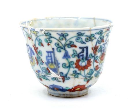 A Chinese doucai ‘lotus and lanca’ cup, the gently rounded sides rising from a short foot to a slightly everted rim, painted 