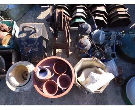 A composition stone plant pot, together with further terracotta and other plant pots, paraffin lamps, etc. (a quantity)