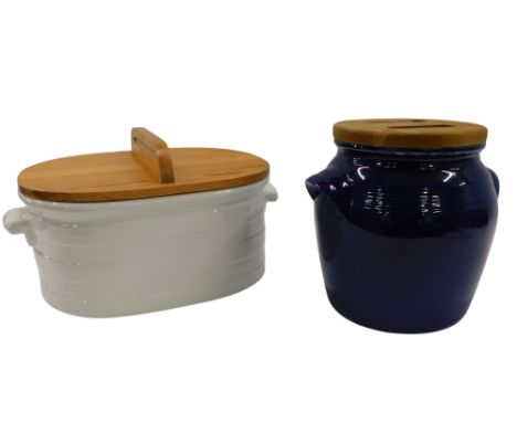 A modern Burleigh ironstone white glazed bread bin with pine cover, and a blue ceramic bread crock with pine cover. (2)