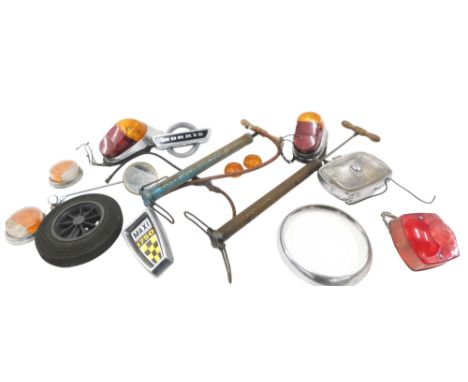 A quantity of vintage car parts, to include a Morris badge, various lights, pumps, etc. 