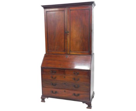 A 19thC mahogany bureau bookcase, the top with a Greek key cornice, above two panelled doors, enclosing adjustable shelves an