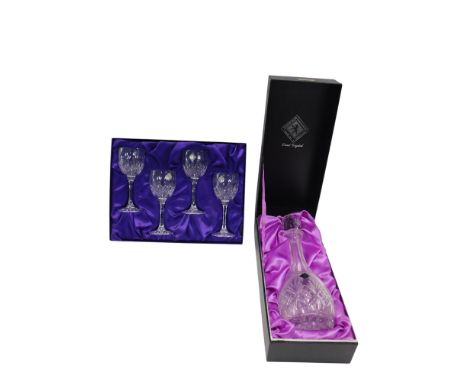 An Edinburgh Crystal decanter and stopper, boxed, and a set of Edinburgh Crystal wine glasses, boxed.
