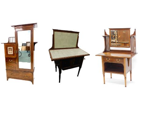 An Edwardian mahogany bedroom suite by James Shoolbred of London, comprising a wardrobe of stepped form, with a mirror door, 
