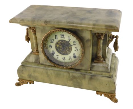An early 20thC simulated onyx wooden mantel clock, the circular dial with white enamel chapter ring, bearing Arabic numerals,