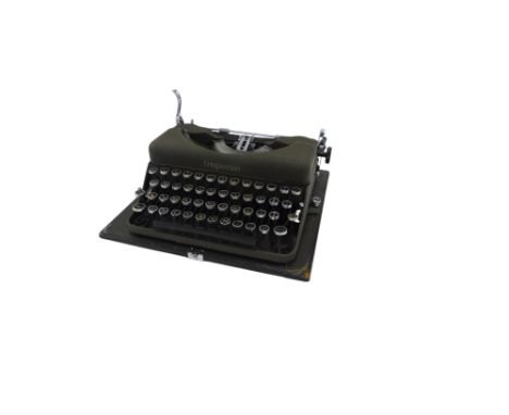 An Imperial vintage portable typewriter, 26cm wide.