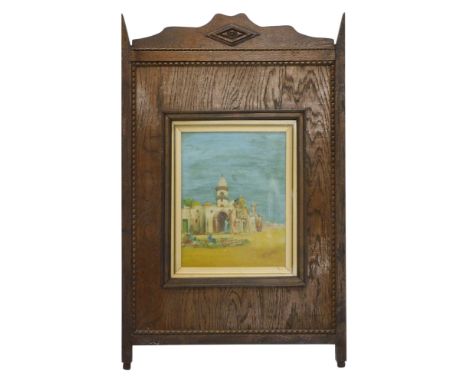 An early 20thC oak fire screen, inset with an oil painted Arab style panel of camel, etc., signed W Burns, 80cm high, 50cm wi