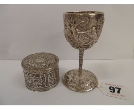 Small Indian silver goblet with tiger hunting scene and an embossed drum shape box and cover (2)