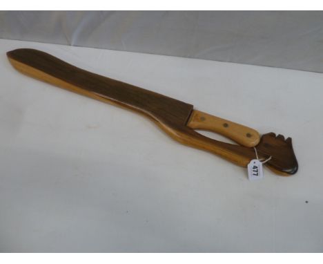 Steel bladed machete in carved wooden scabbard 