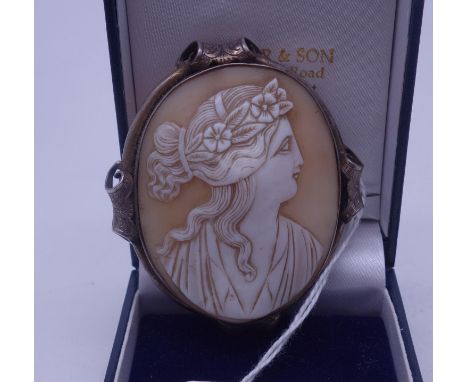 19 th century  oval cameo brooch carved image of a Greek Lady 2.1/4" tall 2" wide in decorative mount, SILVER coloured 