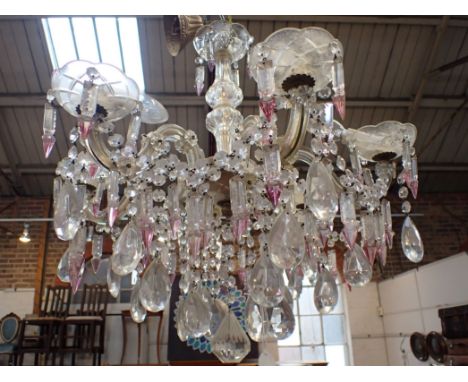 A SIX-BRANCH CHANDELIER, WITH PEAR-SHAPED PENDANT DROPS and pink tinged prismatic drops 55cm diam. (for re-wiring)