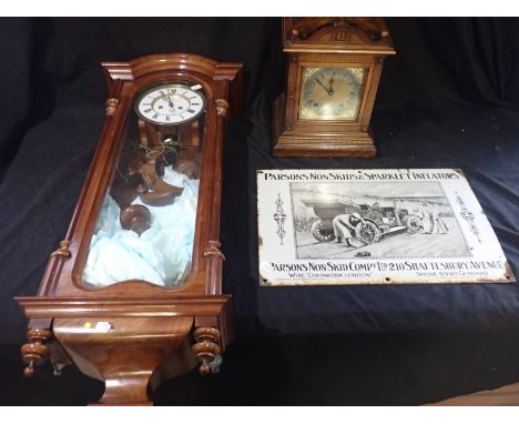 A FRENCH MAHOGANY WALL CLOCK by Shaun Rennes, with a white enamel dial, black Roman numerals and dark steel hands; and a maho