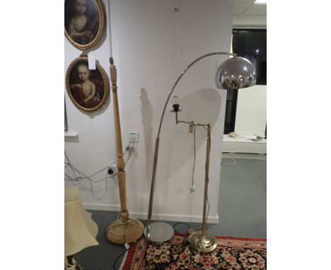 A MID-CENTURY DESIGN STANDARD LAMP with a curved stem, 160cm high, together with two other standard lamps (3)