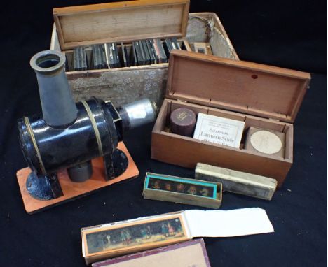 A TINPLATE MAGIC LANTERN, STAMPED 'FLACHBRENNER, WIENER' and a collection of lantern slides, various sizes