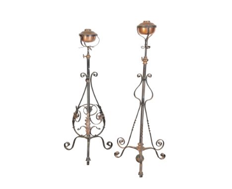 A 19TH CENTURY WROUGHT IRON STANDARD OIL LAMP by Benham &amp; Froud London, with a copper reservoir supported on a columnar s