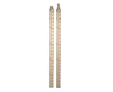 A VINTAGE EXTENDABLE SURVEYOR'S STAFF measuring 160cm when "closed", and another (2)Provenance: The Estate of the Late Rufus 
