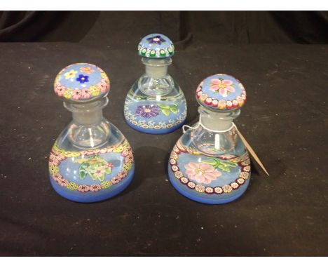 A GROUP OF THREE MILLEFIORI GLASS INKWELL PAPERWEIGHTS the tallest 13cm high, one with a large chip and loss to the neck (3)