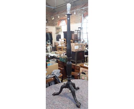 A GEORGE II STYLE STANDARD LAMP with  carved column on tripod base