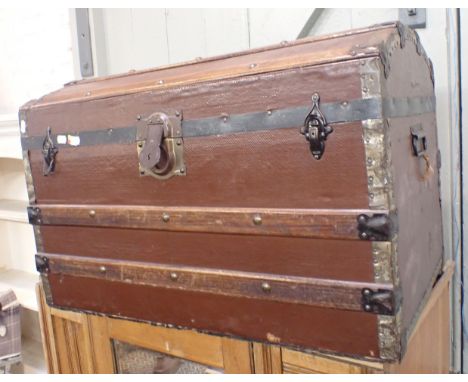 A DOME-TOPPED CANVAS COVERED AND WOOD-BOUND TRUNK 76cm wide