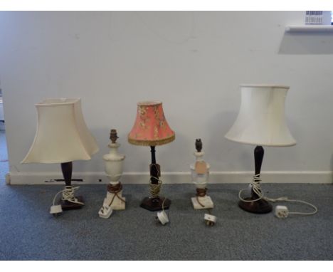 A GROUP OF THREE TRUNED WOOD LAMP BASES the tallest 36cm high, together with two stone lamps (5)