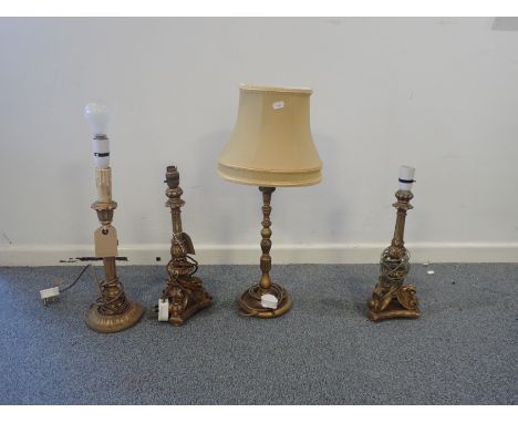 A GROUP OF FOUR CARVED GILTWOOD AND COMPOSITION LAMP BASES the tallest 36cm high (4)