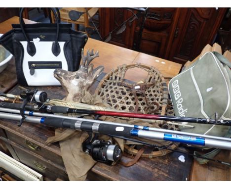 A CELINE PARIS HANDBAG AND A PAIR OF VINTAGE SNOW SHOES with fishing rods, sunshades, a plaster deer head and a BBC shoulder 